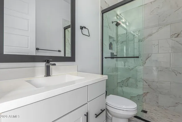 a backyard of a house with yard and outdoor seating