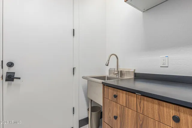 a room with gym equipment and floor to ceiling windows