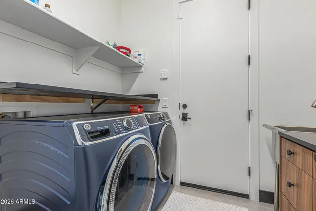a living room with lots of furniture and large windows
