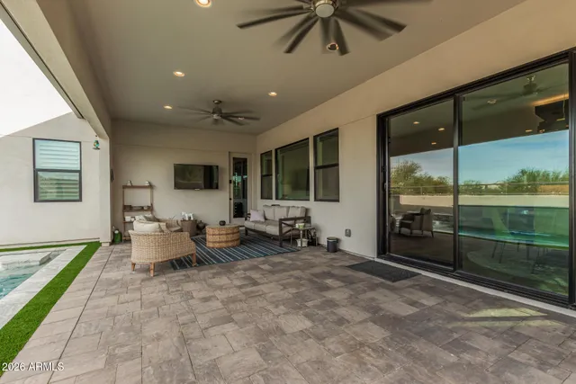 a view of a field of grass and trees
