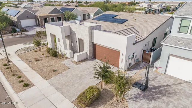 a view of a patio with couches and city view