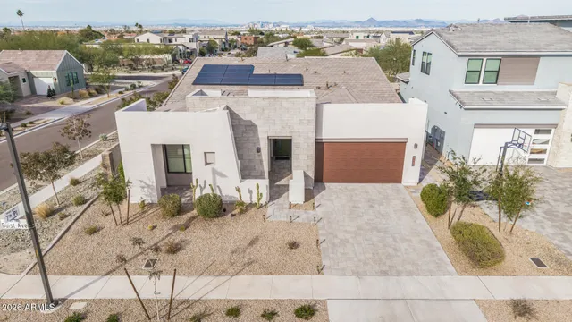 a view of white house with a yard