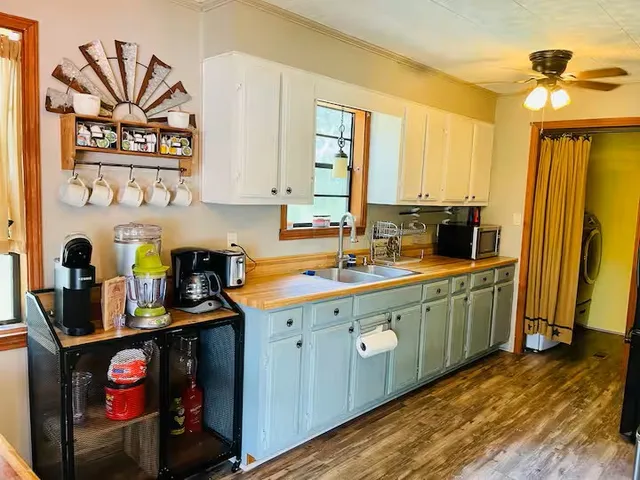 a bedroom with furniture and wooden floor
