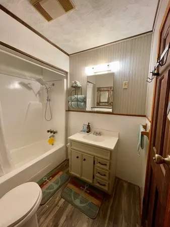 a view of a tree in the middle of a yard