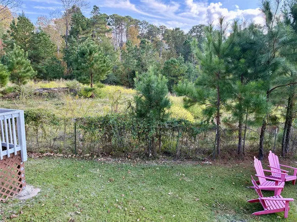 a view of a yard with a tree