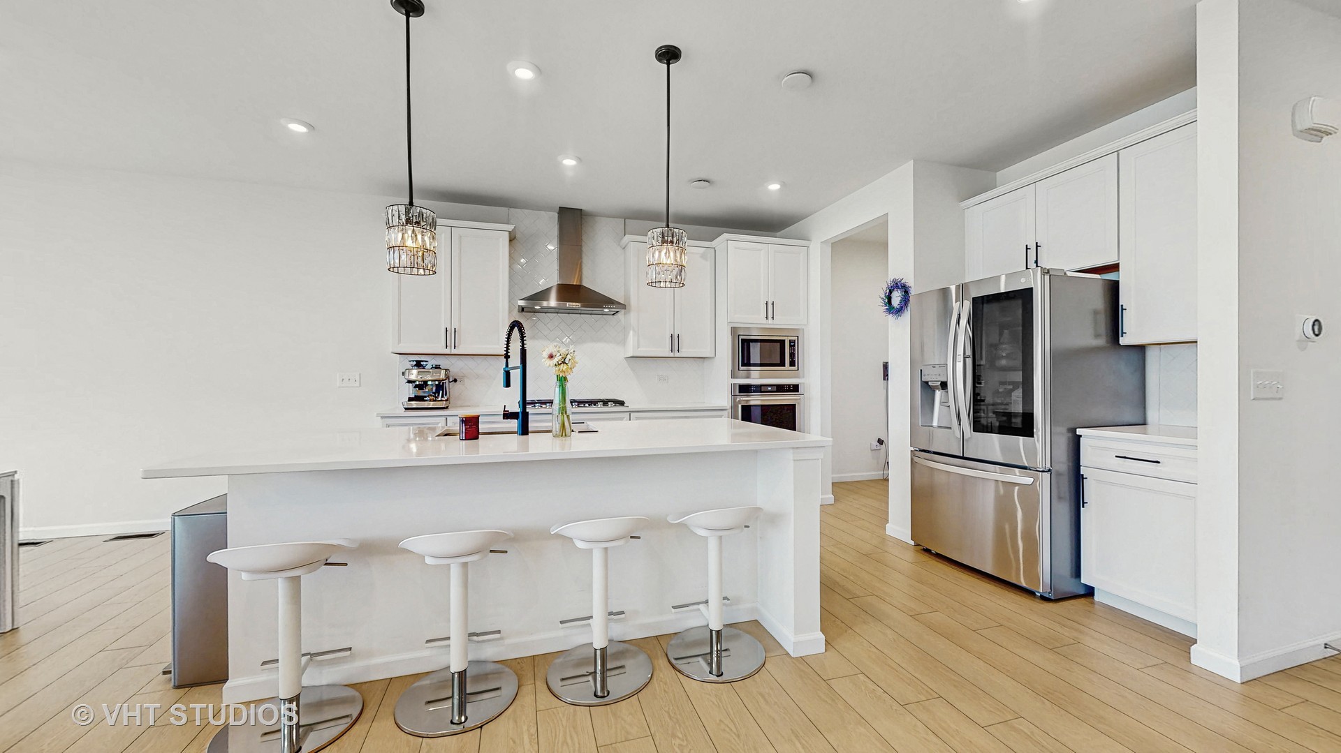 1248 Snapper Road Naperville, IL 60563 - Photo 4 of 34 a kitchen with white cabinets and stainless steel appliances