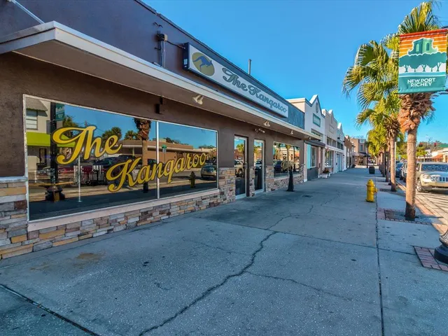a view of a chairs and table in the patio