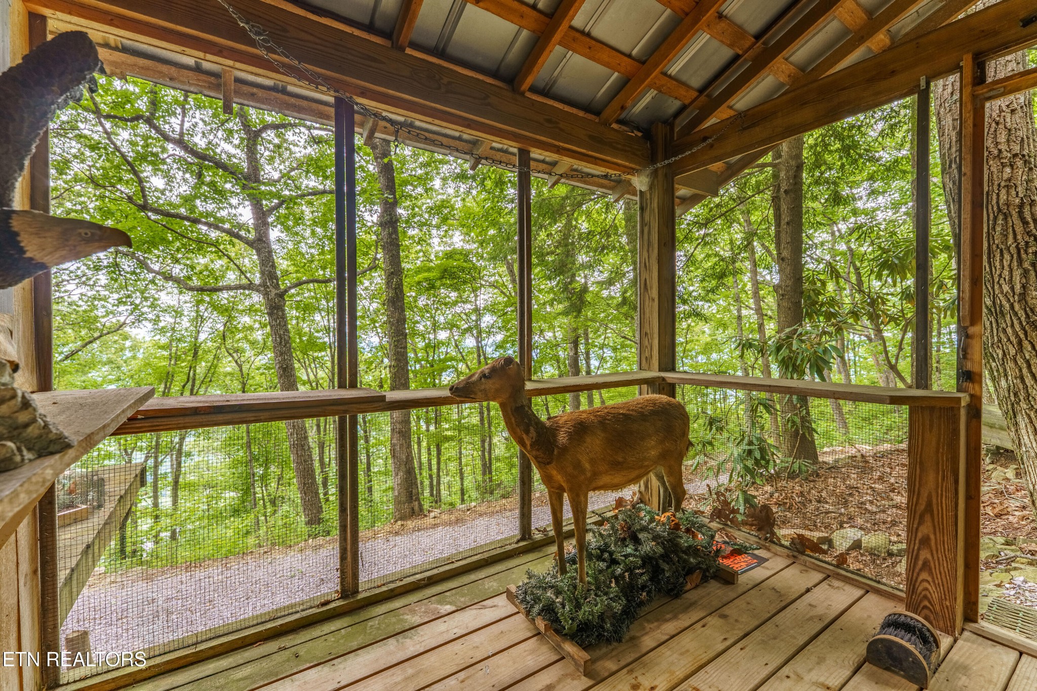 2939 Dupont Springs Road Sevierville, TN 37862 - Photo 13 of 20 a view of a porch with furniture and wooden floor