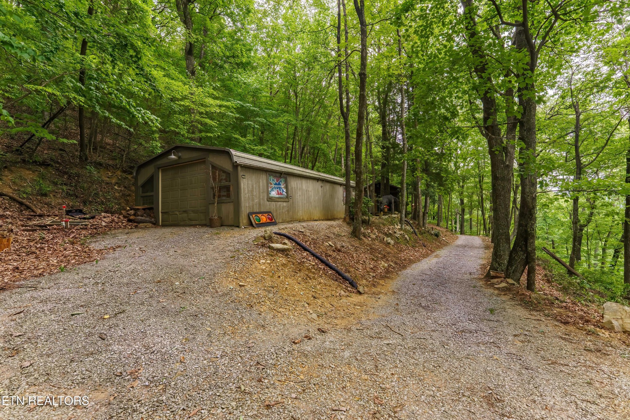2939 Dupont Springs Road Sevierville, TN 37862 - Photo 18 of 20 a view of a house with a tree in the background