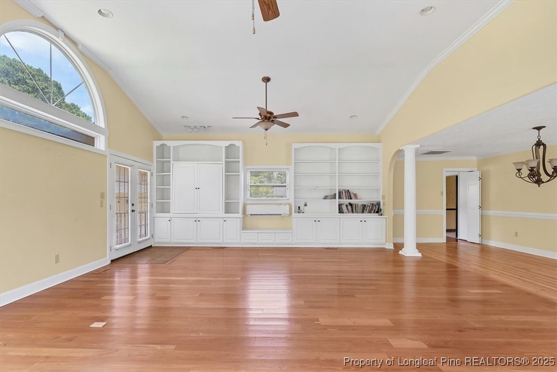 363 Bee Gee Road Lumberton, NC 28358 - Photo 11 of 45 a view of an empty room with window and wooden floor