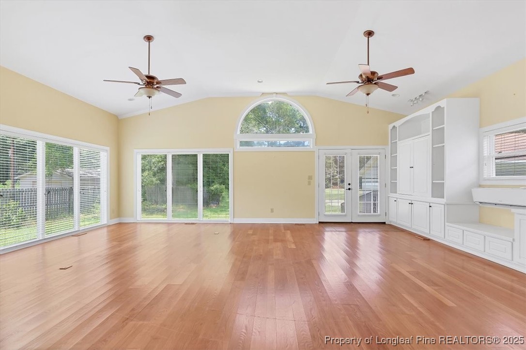 363 Bee Gee Road Lumberton, NC 28358 - Photo 12 of 45 a view of an empty room with a window and wooden floor