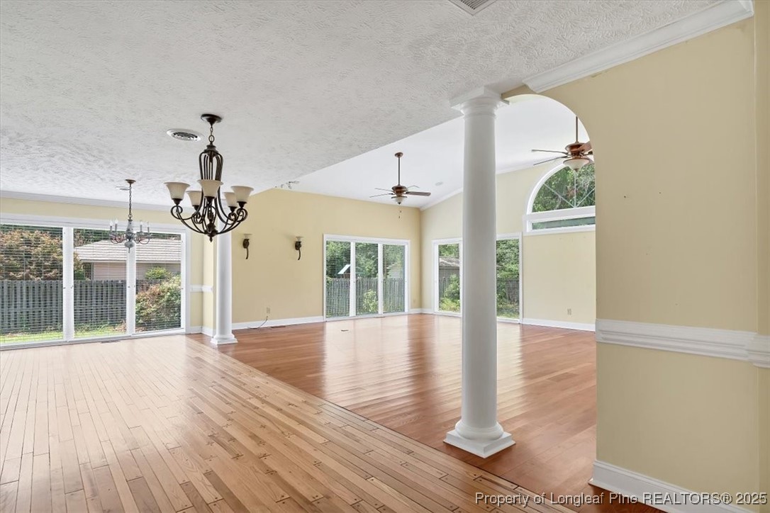 363 Bee Gee Road Lumberton, NC 28358 - Photo 13 of 45 wooden floor in an empty room with a window