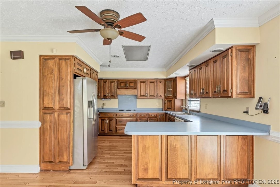 363 Bee Gee Road Lumberton, NC 28358 - Photo 18 of 45 a kitchen with refrigerator and cabinets