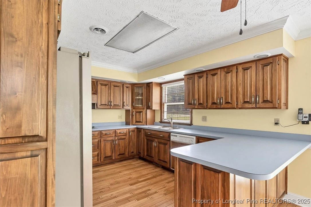 363 Bee Gee Road Lumberton, NC 28358 - Photo 19 of 45 a kitchen with a sink window and cabinets