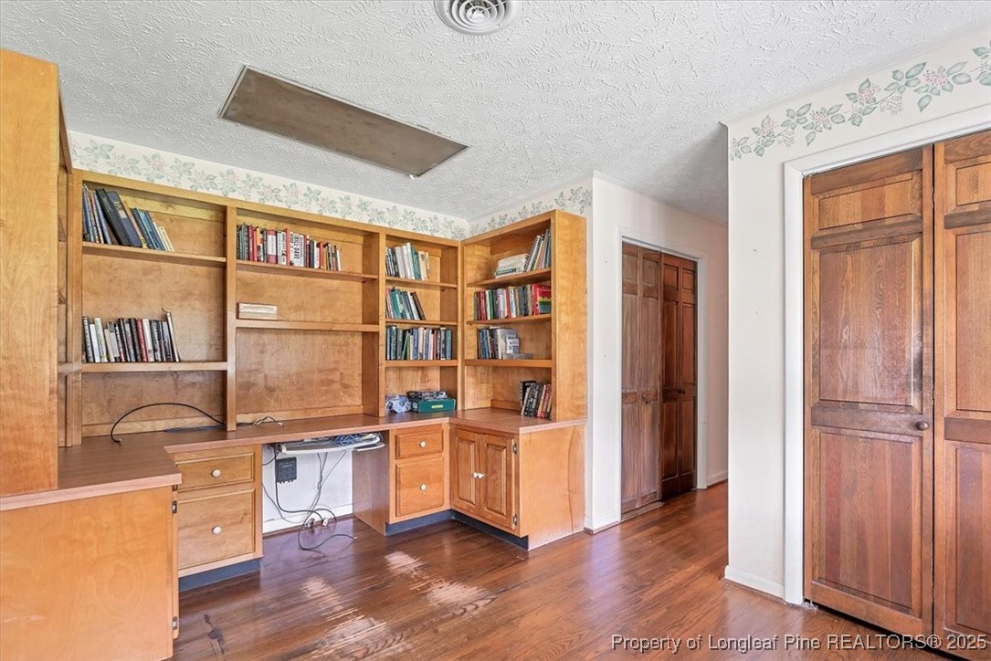 363 Bee Gee Road Lumberton, NC 28358 - Photo 25 of 45 a room with furniture cabinets stainless steel appliances and wooden floor