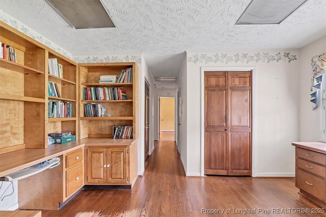 363 Bee Gee Road Lumberton, NC 28358 - Photo 29 of 45 a view of empty room with wooden floor and cabinet