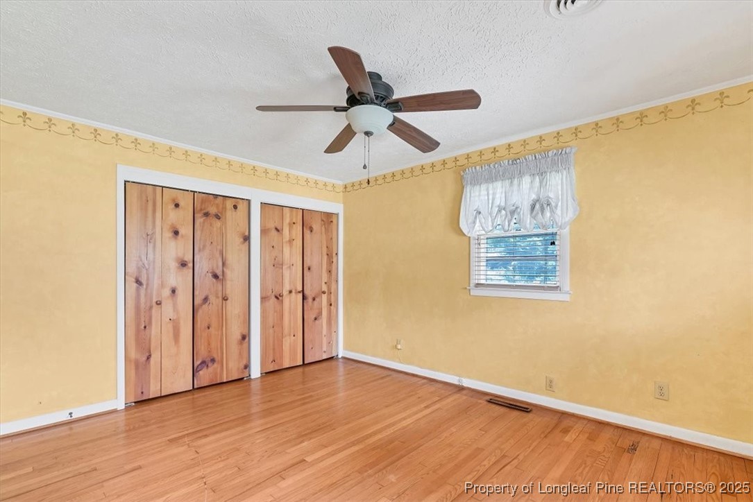 363 Bee Gee Road Lumberton, NC 28358 - Photo 37 of 45 a view of a big room with wooden floor and windows