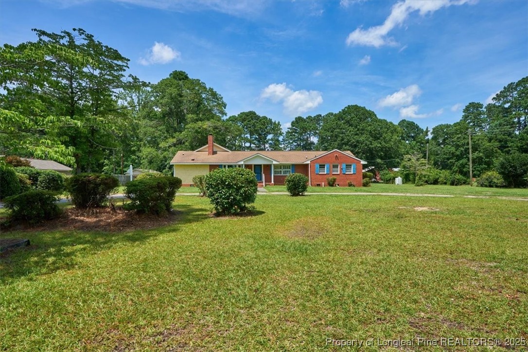 363 Bee Gee Road Lumberton, NC 28358 - Photo 4 of 45 a front view of a house with garden