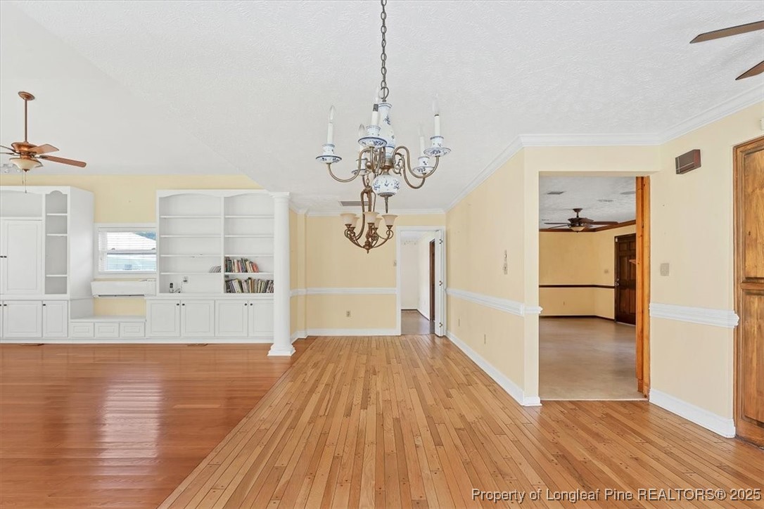 363 Bee Gee Road Lumberton, NC 28358 - Photo 7 of 45 a view of a room with wooden floor and cabinet