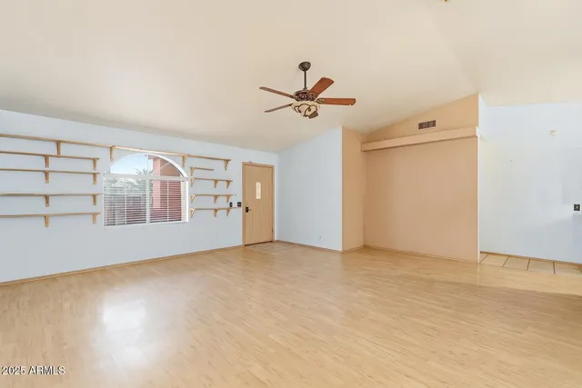 a view of empty room with windows