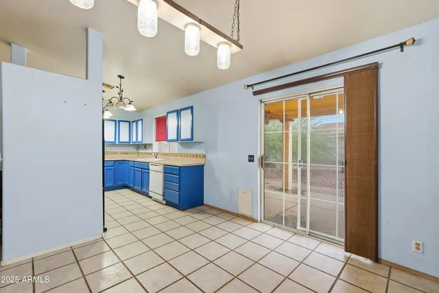 a kitchen with a sink cabinets and window