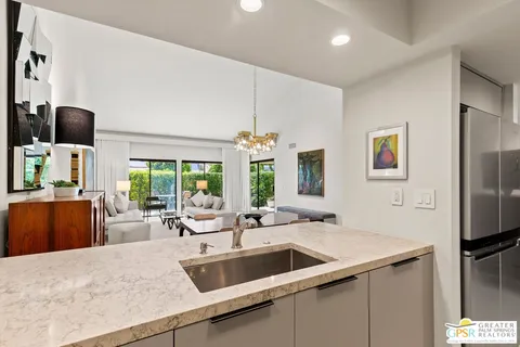 a kitchen with a sink and a refrigerator