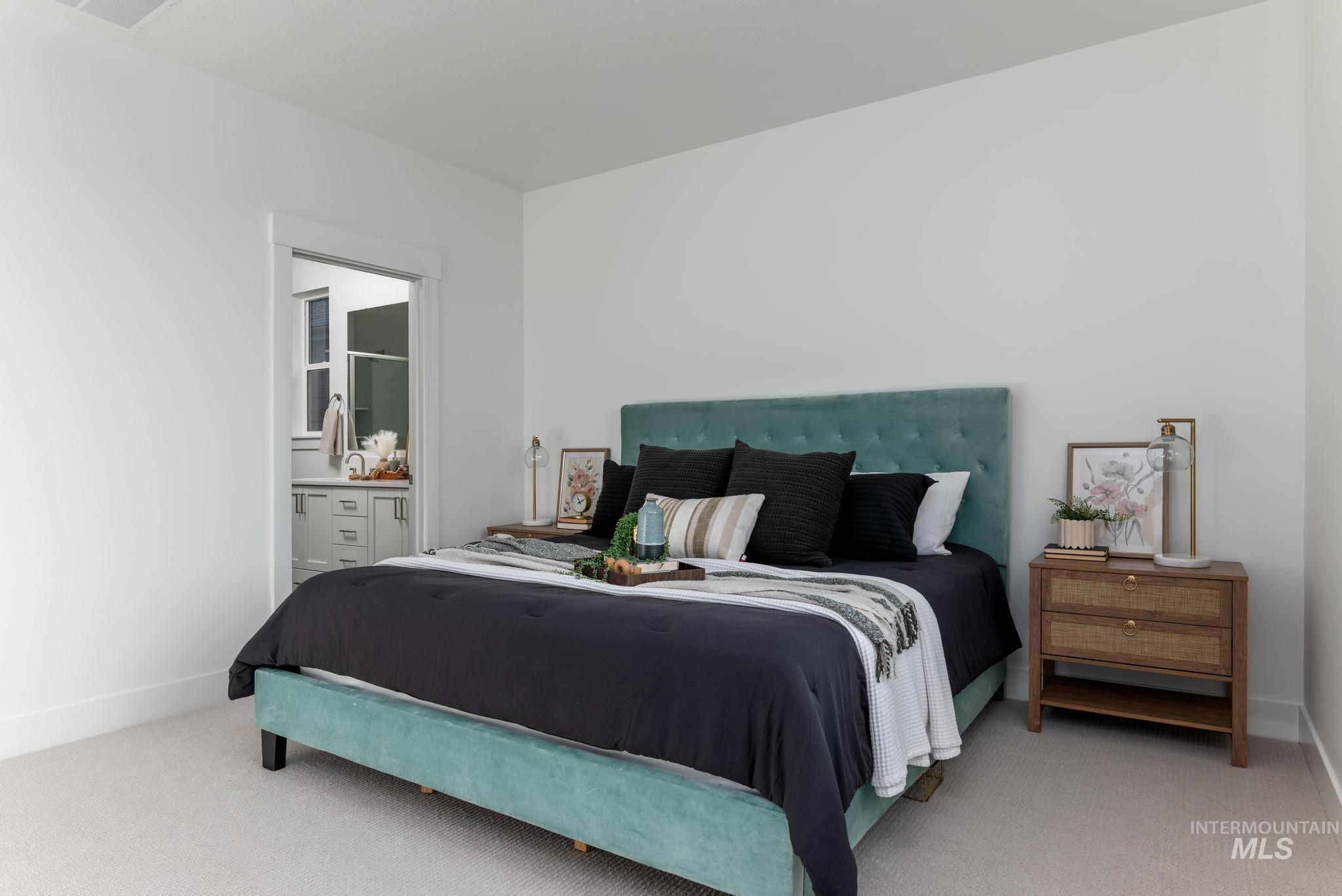 822 West Bay Street Middleton, ID 83644 - Photo 8 of 11 Carpeted bedroom featuring ensuite bathroom and baseboards