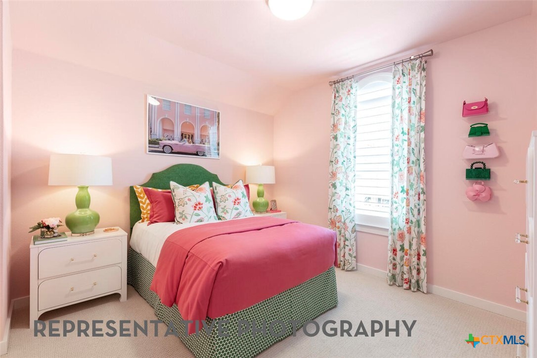 511 Fawn Ridge Cibolo, TX 78108 - Photo 17 of 22 a bedroom with a bed and a book shelf