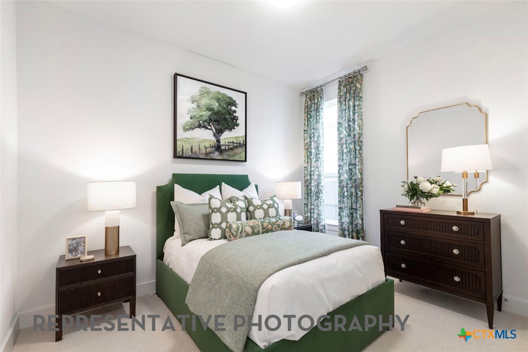 511 Fawn Ridge Cibolo, TX 78108 - Photo 18 of 22 a bedroom with a bed and a dresser