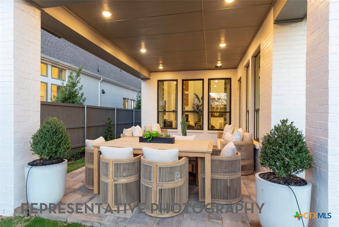 511 Fawn Ridge Cibolo, TX 78108 - Photo 20 of 22 a view of a patio with table and chairs and potted plants