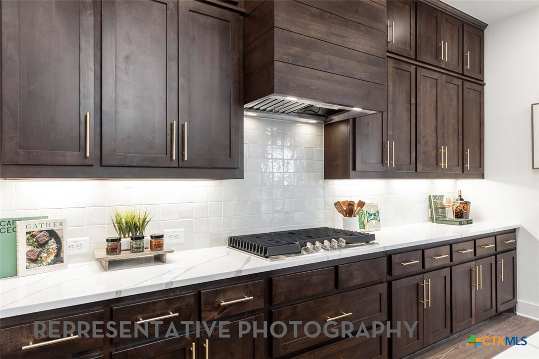 511 Fawn Ridge Cibolo, TX 78108 - Photo 2 of 22 a kitchen with stainless steel appliances granite countertop a sink stove and cabinets