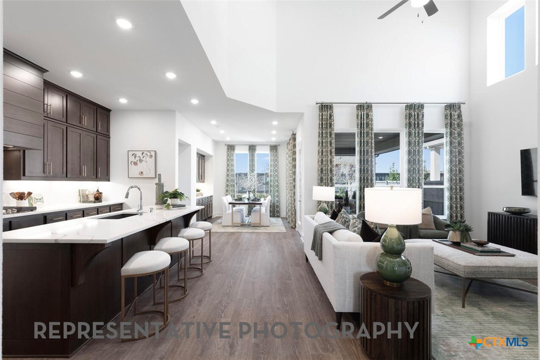 511 Fawn Ridge Cibolo, TX 78108 - Photo 3 of 22 a living room with furniture kitchen view and a large window