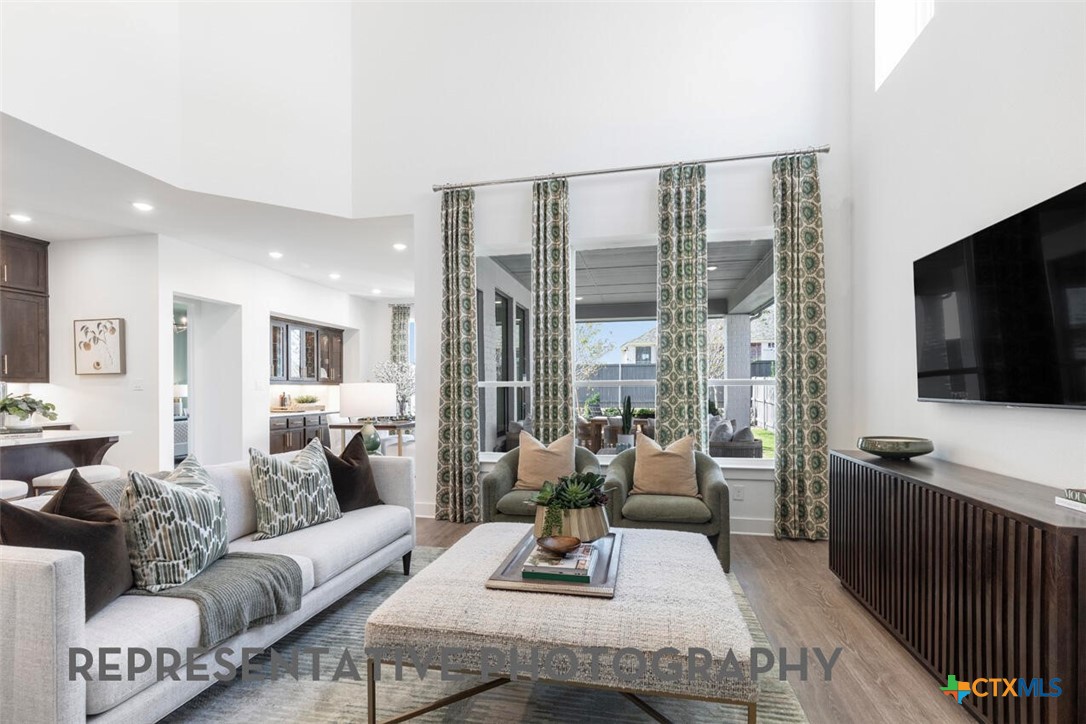 511 Fawn Ridge Cibolo, TX 78108 - Photo 8 of 22 a living room with furniture and a flat screen tv