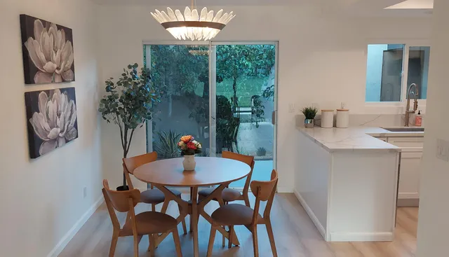 a dining room with furniture and window
