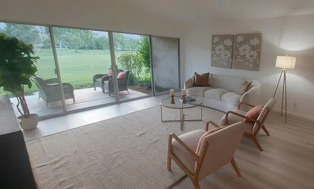 a living room with furniture and a large window