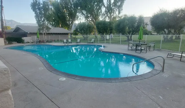 a view of a swimming pool with a patio