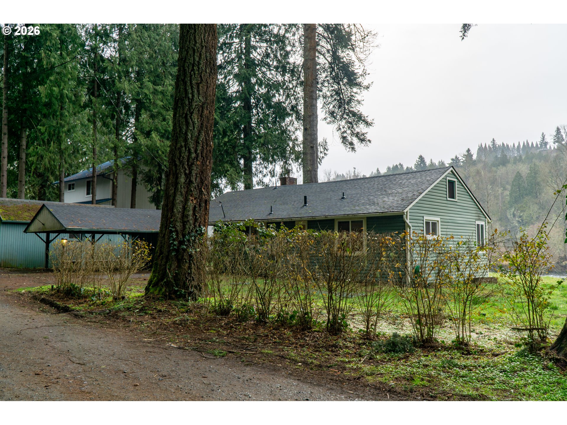 28821 Southeast Paradise Road Eagle Creek, OR 97022 - Photo 3 of 47 a view of a house with a yard and potted plants