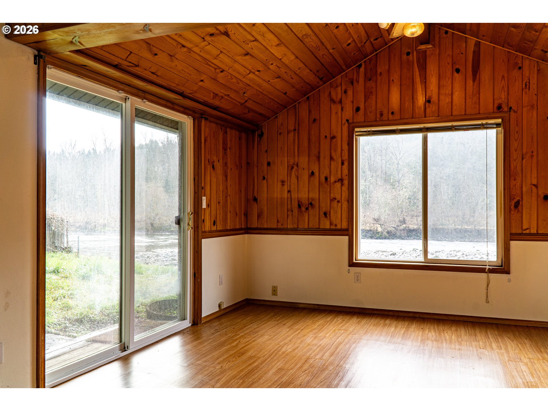 28821 Southeast Paradise Road Eagle Creek, OR 97022 - Photo 31 of 47 a view of a room with wooden floor and windows