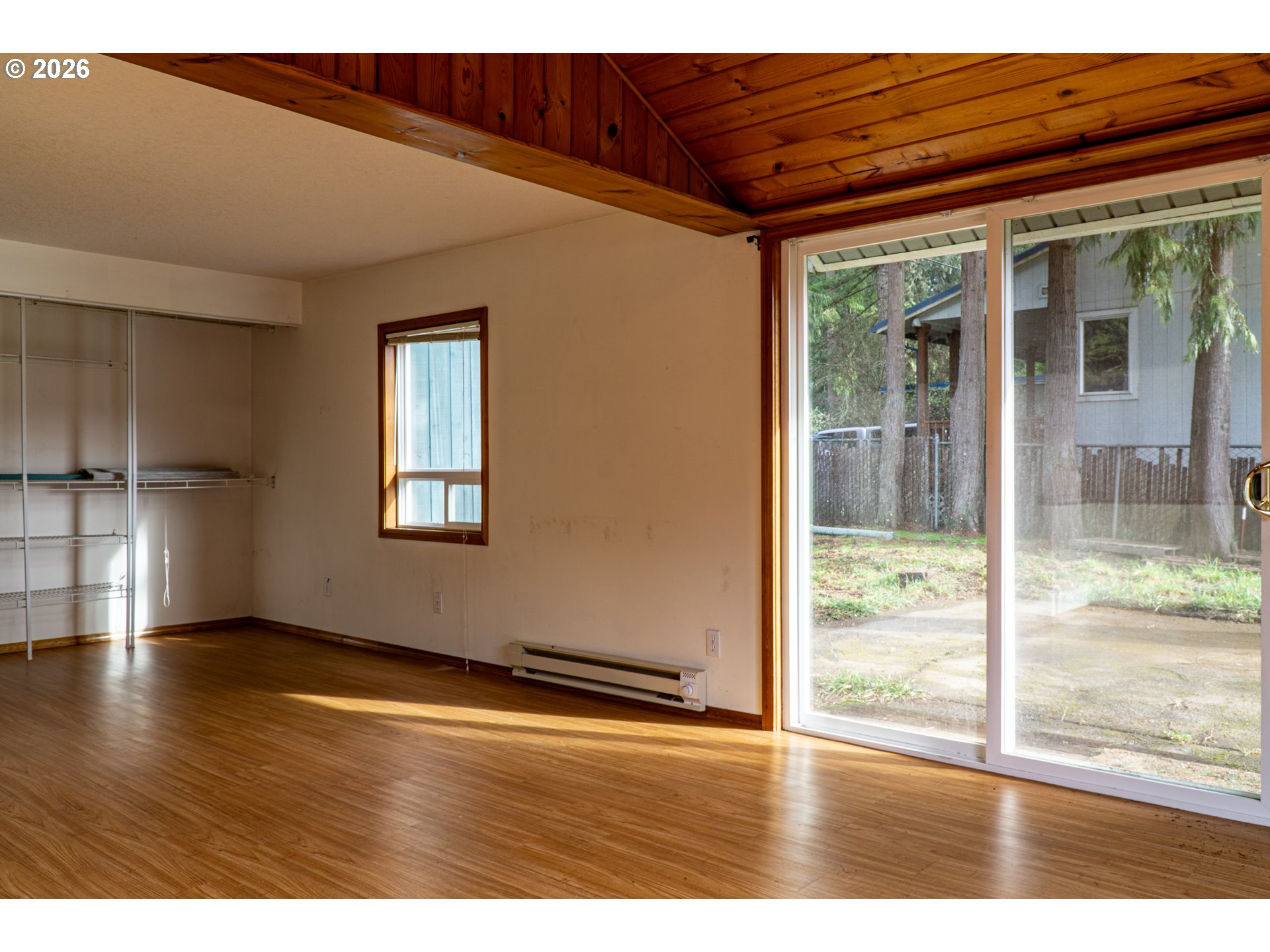 28821 Southeast Paradise Road Eagle Creek, OR 97022 - Photo 34 of 47 a view of an empty room with wooden floor and a window