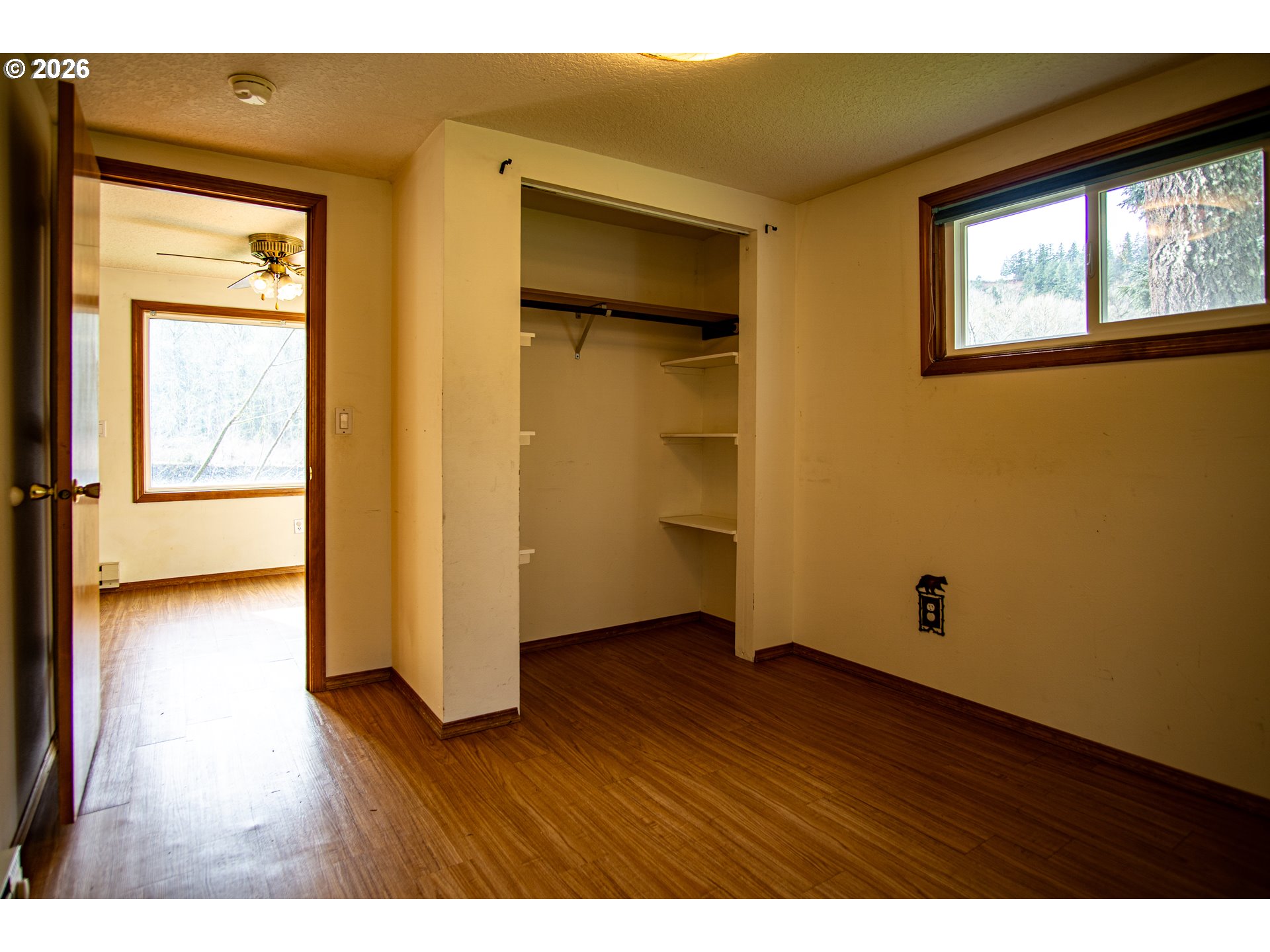 28821 Southeast Paradise Road Eagle Creek, OR 97022 - Photo 37 of 47 a view of an empty room with wooden floor and a window