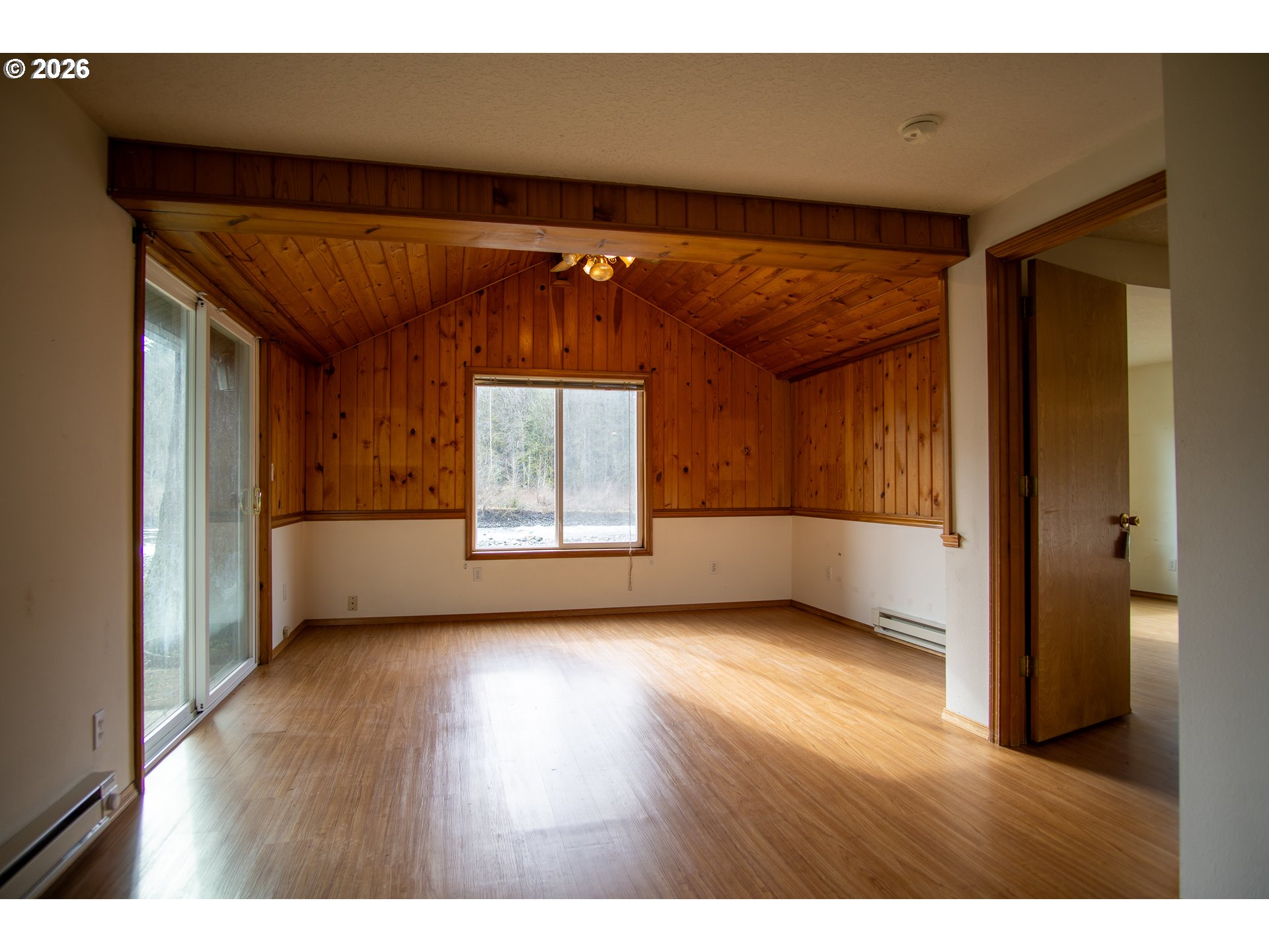 28821 Southeast Paradise Road Eagle Creek, OR 97022 - Photo 42 of 47 a view of empty room with wooden floor and fan