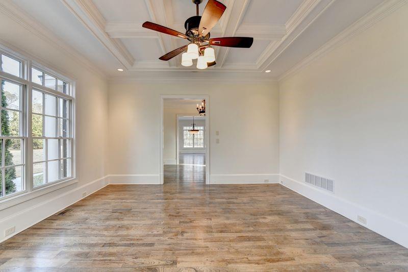 4045 Ridge Road Buford, GA 30519 - Photo 12 of 97 wooden floor in an empty room with a window