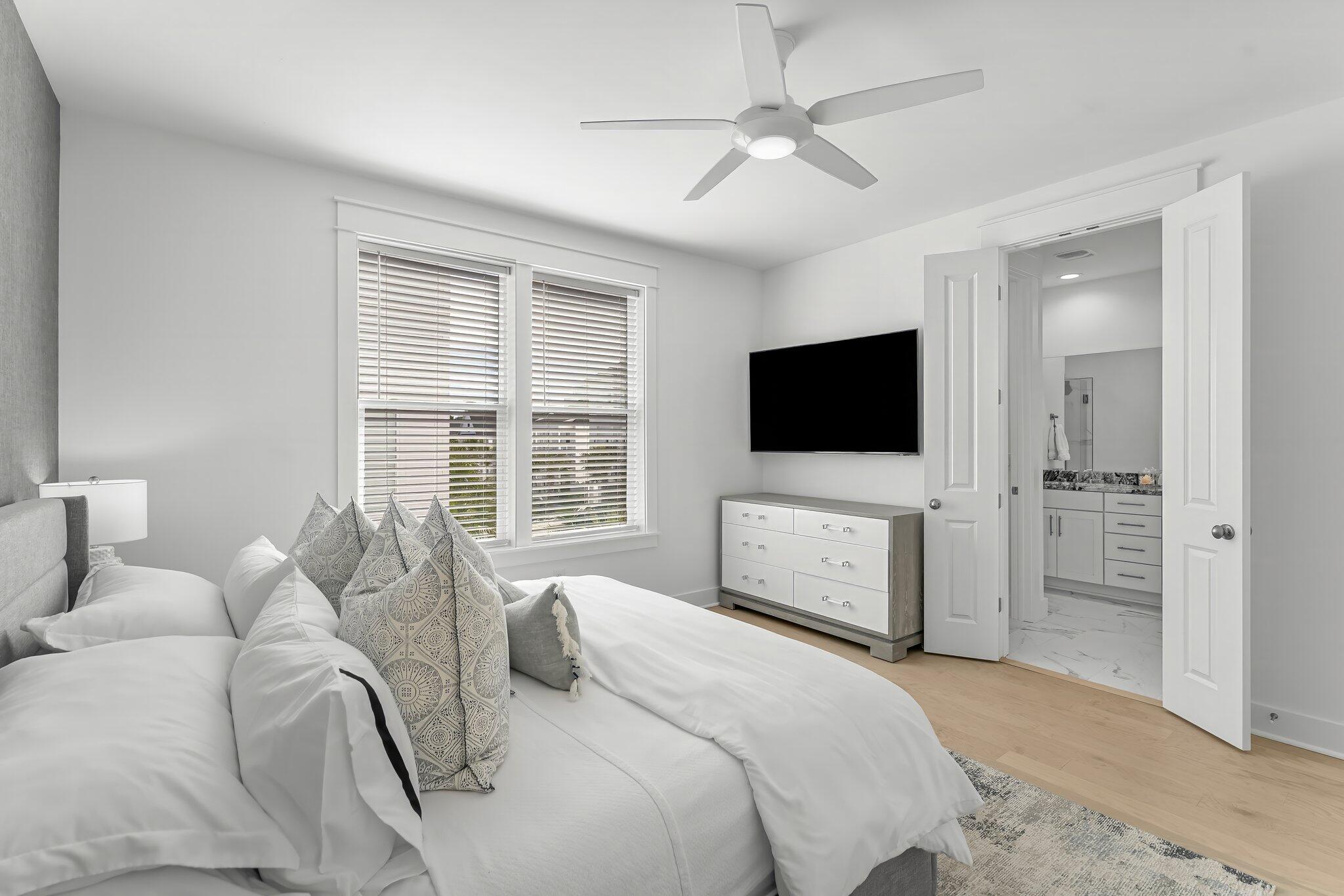 15 Beach View Drive Inlet Beach, FL 32461 - Photo 10 of 46 a bedroom with a bed television on desk and a window