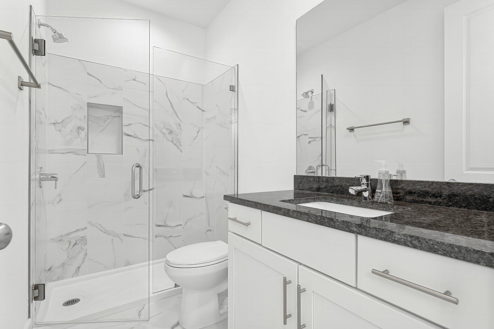 15 Beach View Drive Inlet Beach, FL 32461 - Photo 20 of 46 a bathroom with a granite countertop sink a toilet and shower