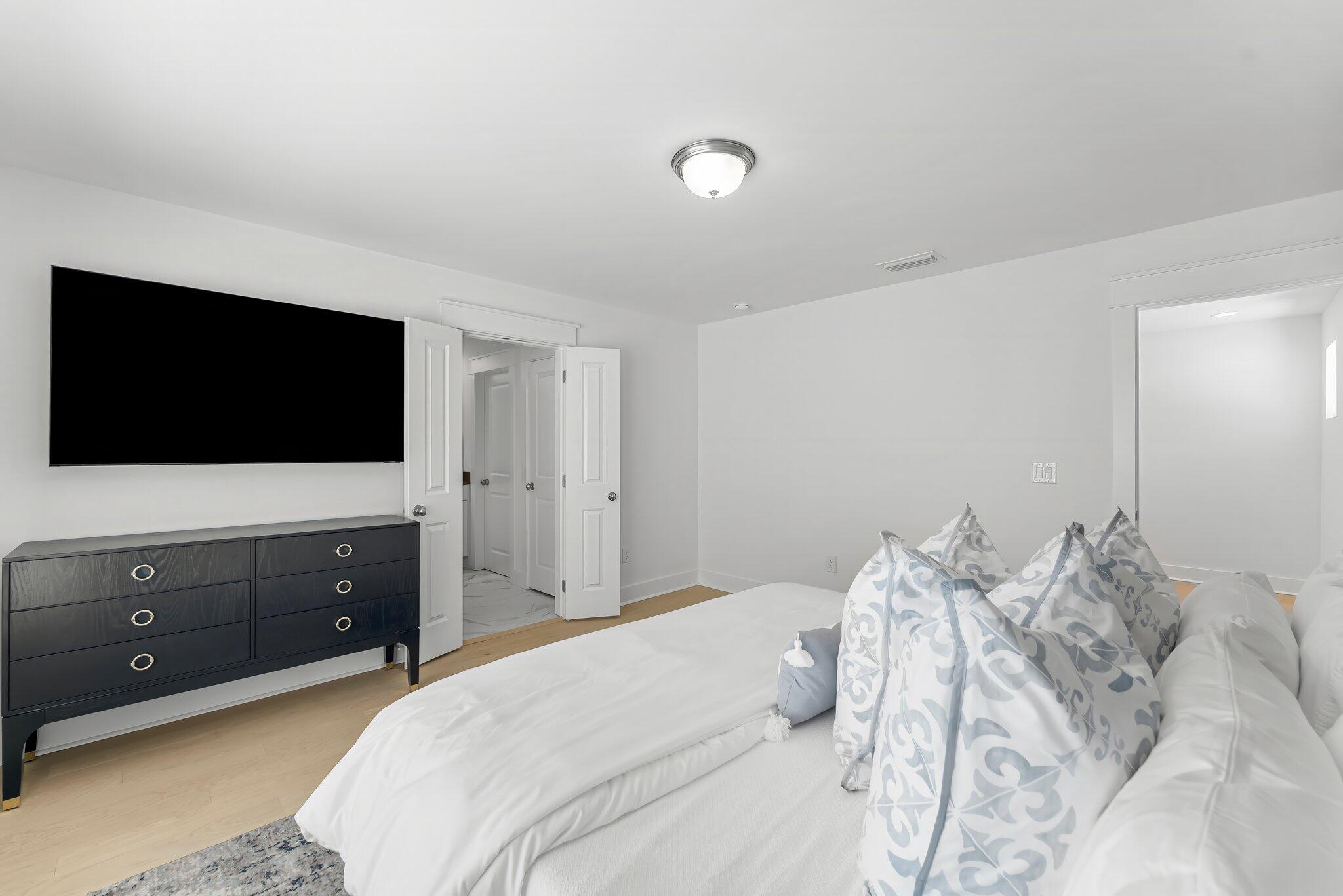 15 Beach View Drive Inlet Beach, FL 32461 - Photo 21 of 46 a bedroom with a bed and a flat screen tv