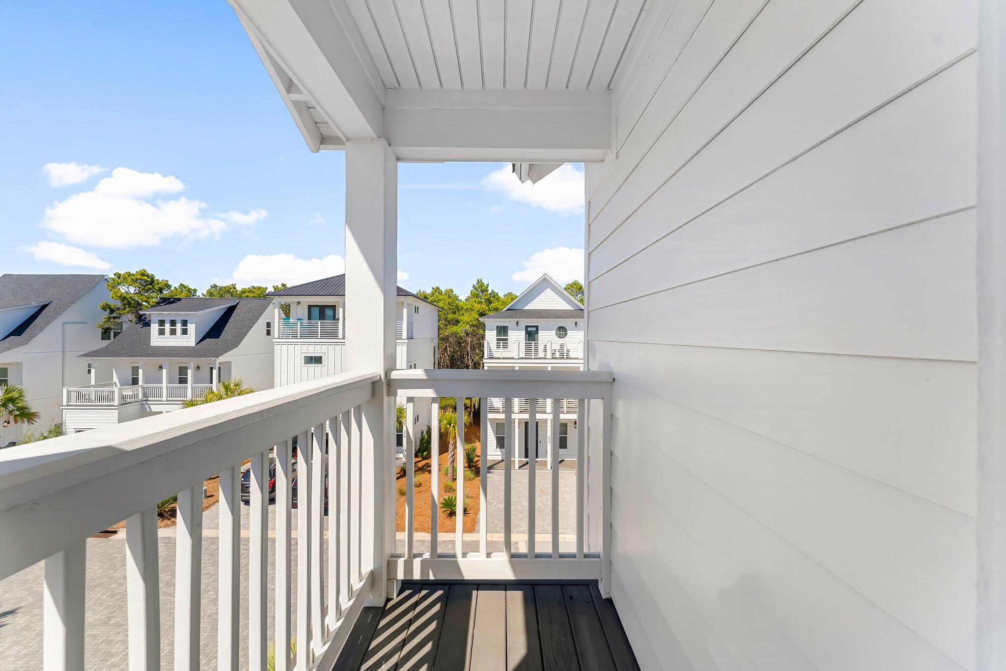 15 Beach View Drive Inlet Beach, FL 32461 - Photo 26 of 46 a view of staircase with lots of frames on wall and a potted plant