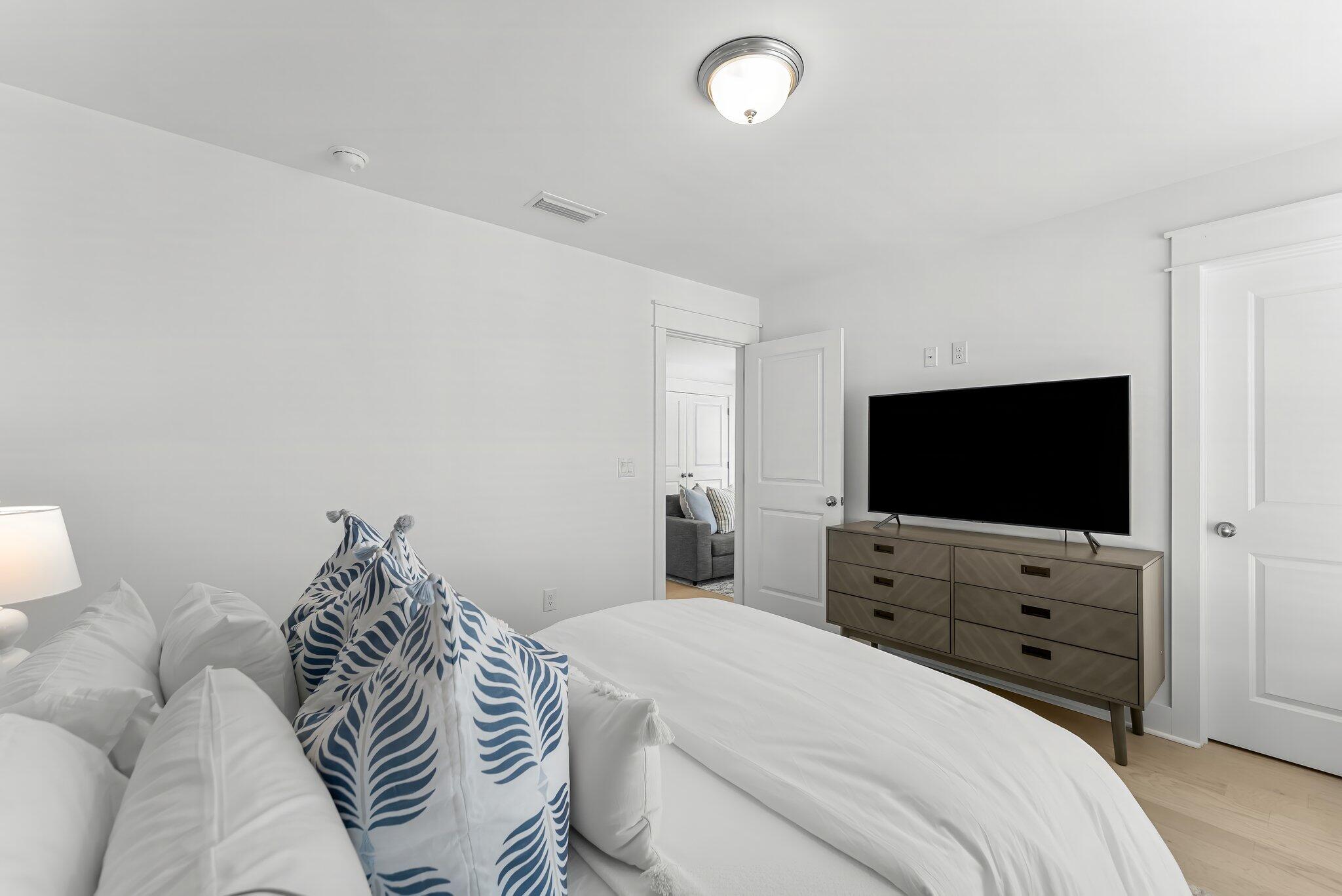 15 Beach View Drive Inlet Beach, FL 32461 - Photo 31 of 46 a bedroom with a bed and a flat screen tv