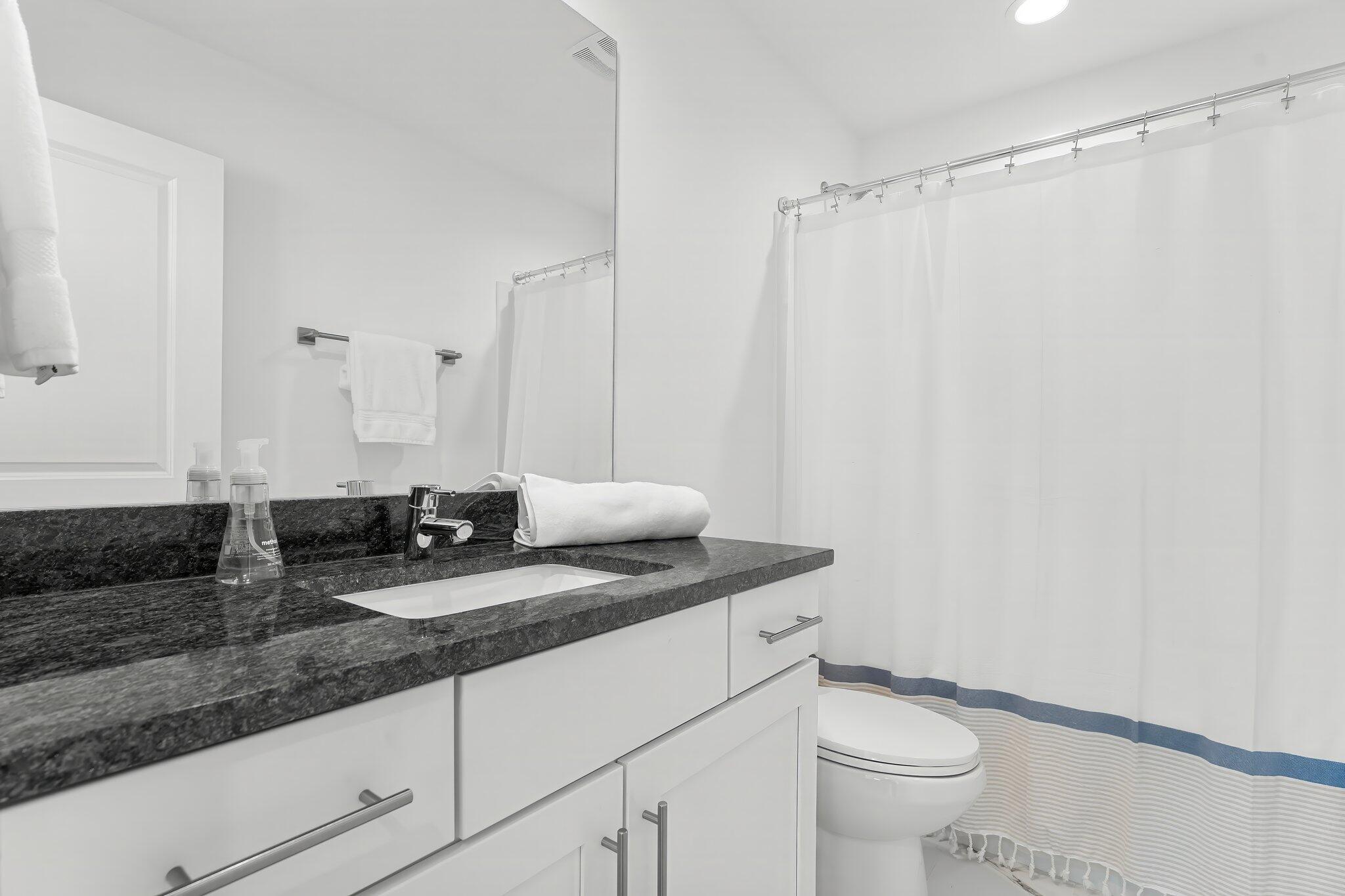 15 Beach View Drive Inlet Beach, FL 32461 - Photo 32 of 46 a bathroom with a granite countertop sink a toilet and a mirror