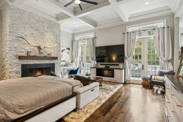 a bedroom with a bed couch and window