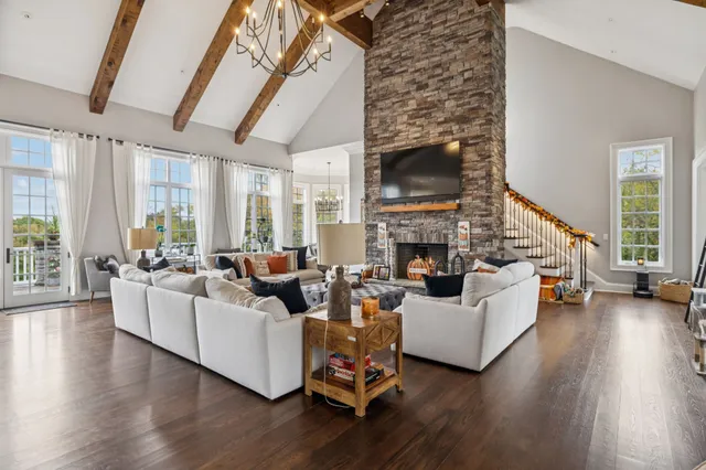 a view of swimming pool with outdoor seating and plants